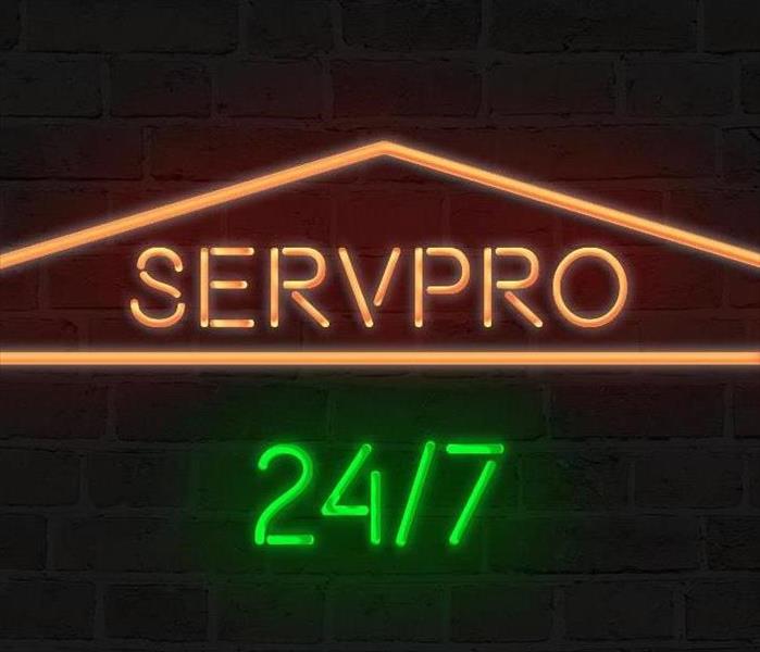 neon glow sign of SERVPRO logo